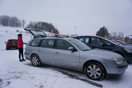 Car next to the skiing hill